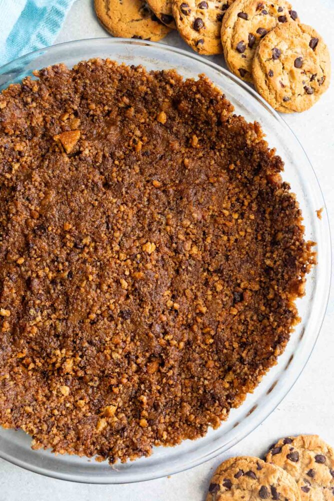 Overhead shot of chocolate chip cookie crust with chocolate chip cookies around it