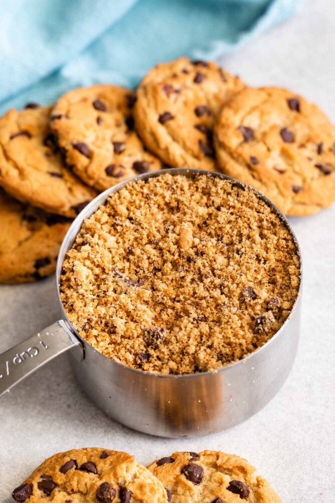 One cup of chocolate chip cookies crushed with chocolate chip cookies around it