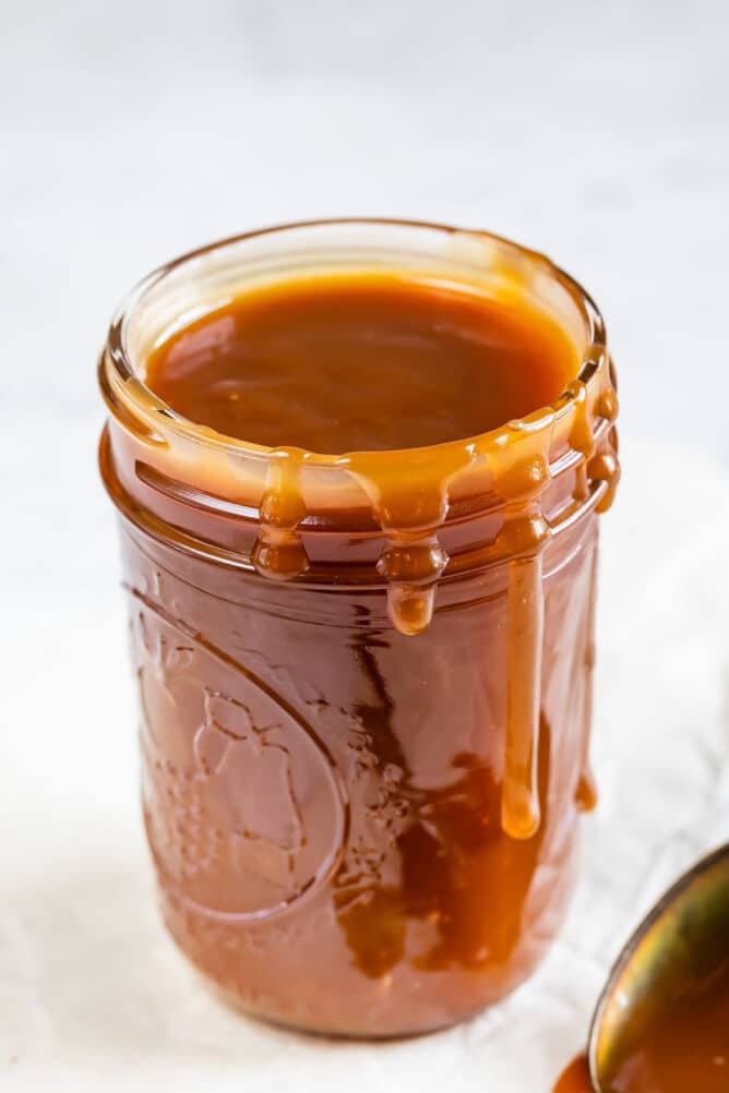Mason jar full of easy homemade caramel sauce