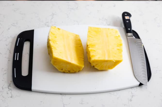 pineapple wedges on white cutting board