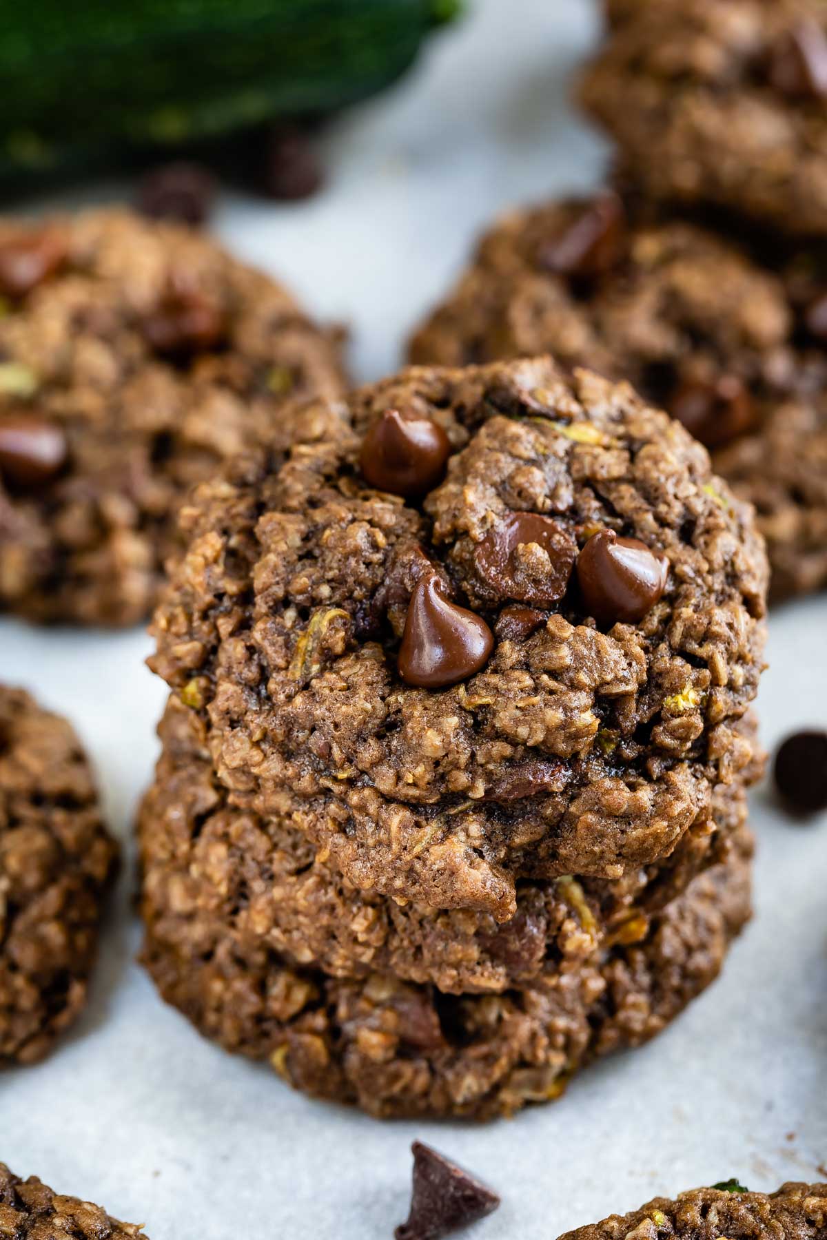 Chocolate zucchini oatmeal cookies stacked on eachother