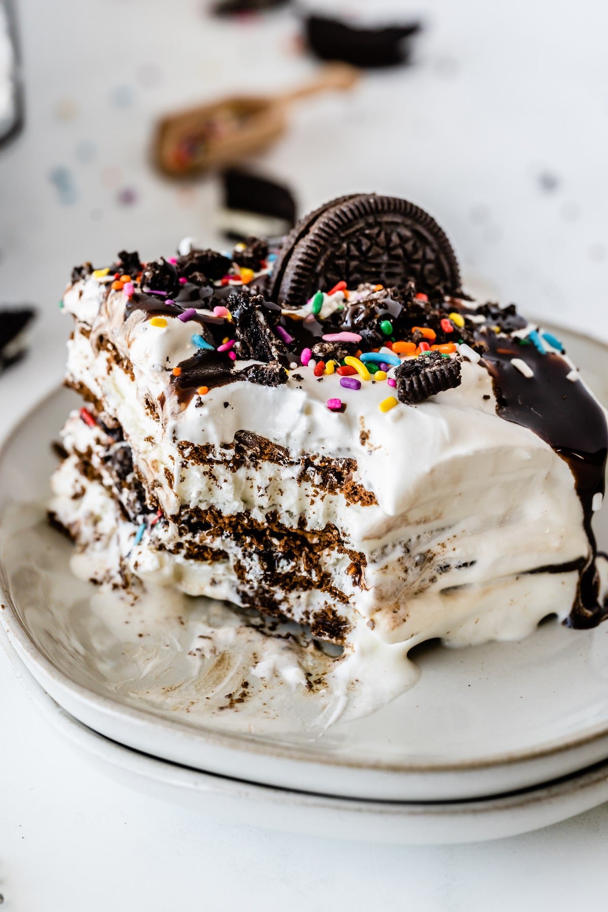 One slice of ice cream sandwich cake with one bite missing