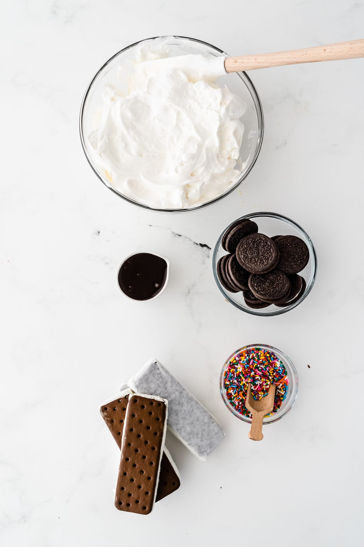 Overhead shot showing five ingredients needed to make ice cream sandwich cake