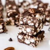 Three easy rocky road bars stacked on eachother with more in the background