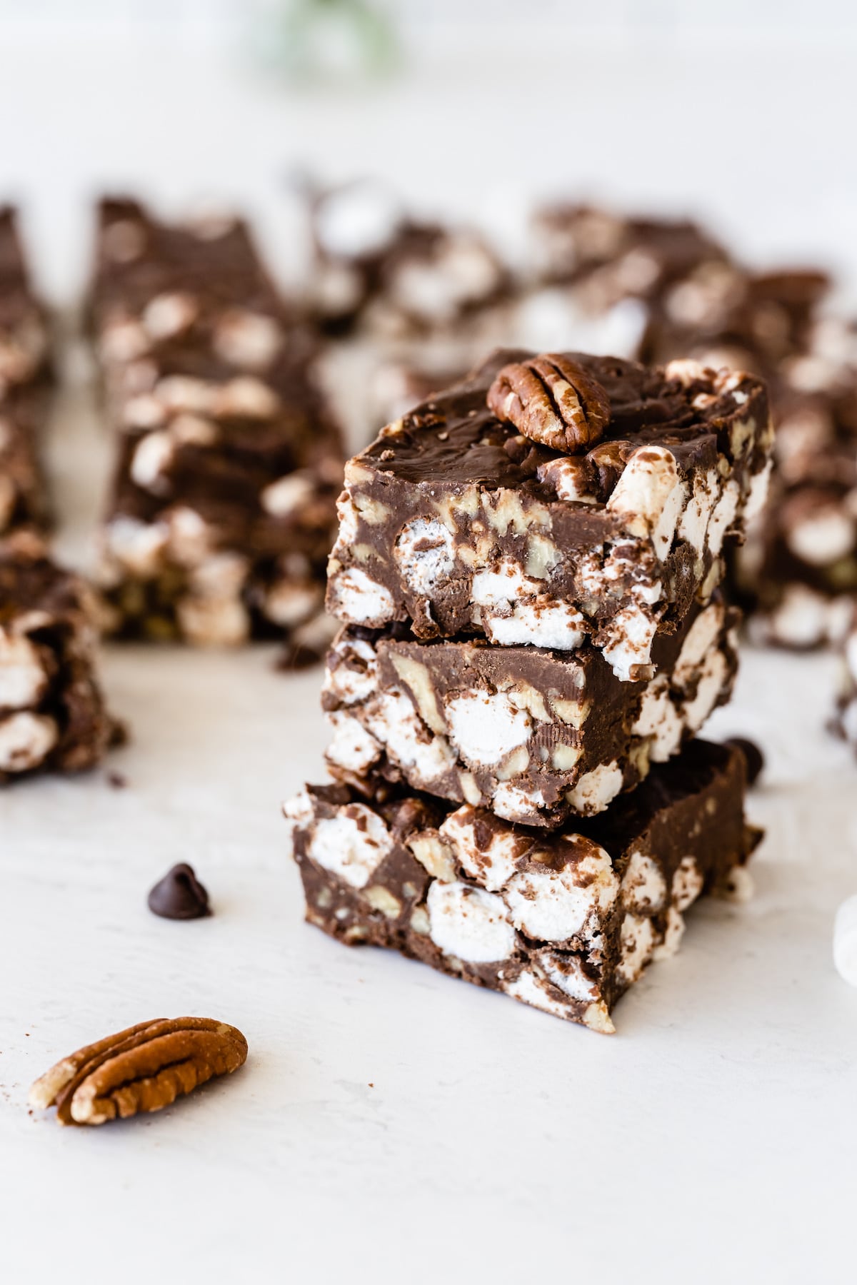 Three easy rocky road bars stacked on eachother with more in the background