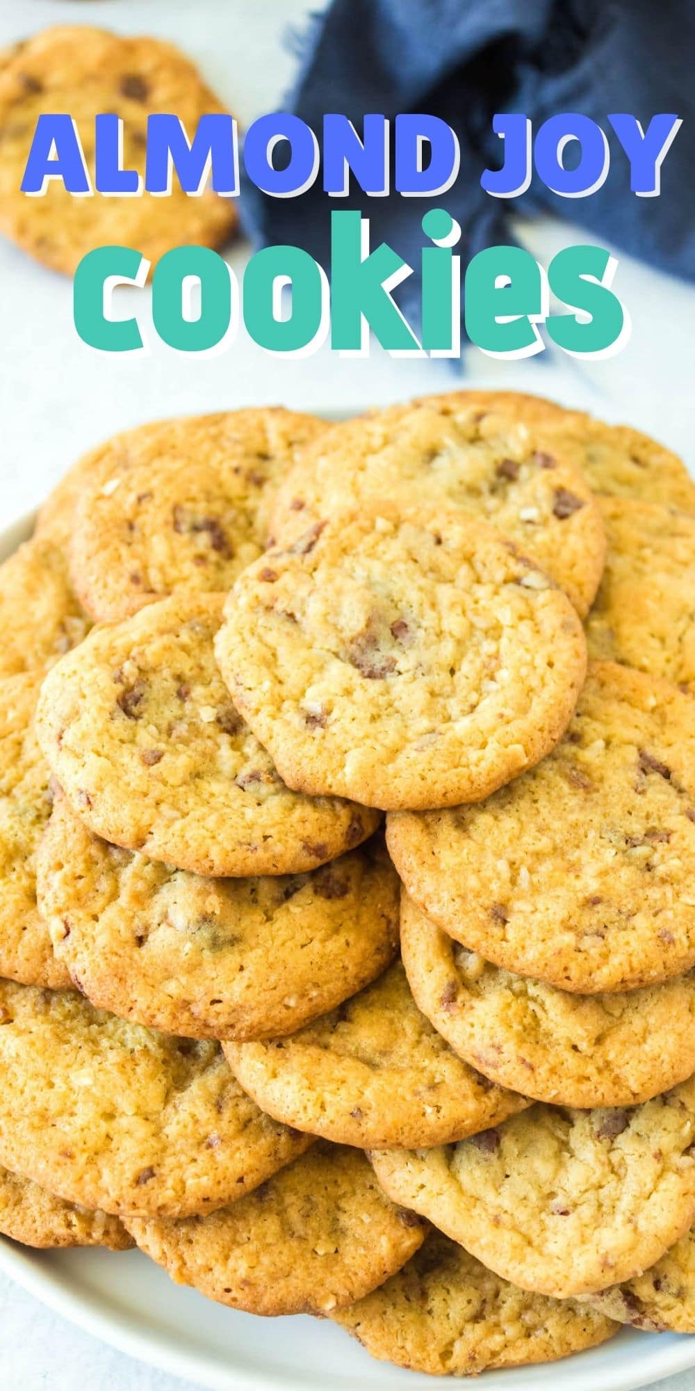 Plate full of almond joy pudding cookies with recipe title on top of image