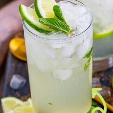 Mojito in a glass with recipe title on top of image