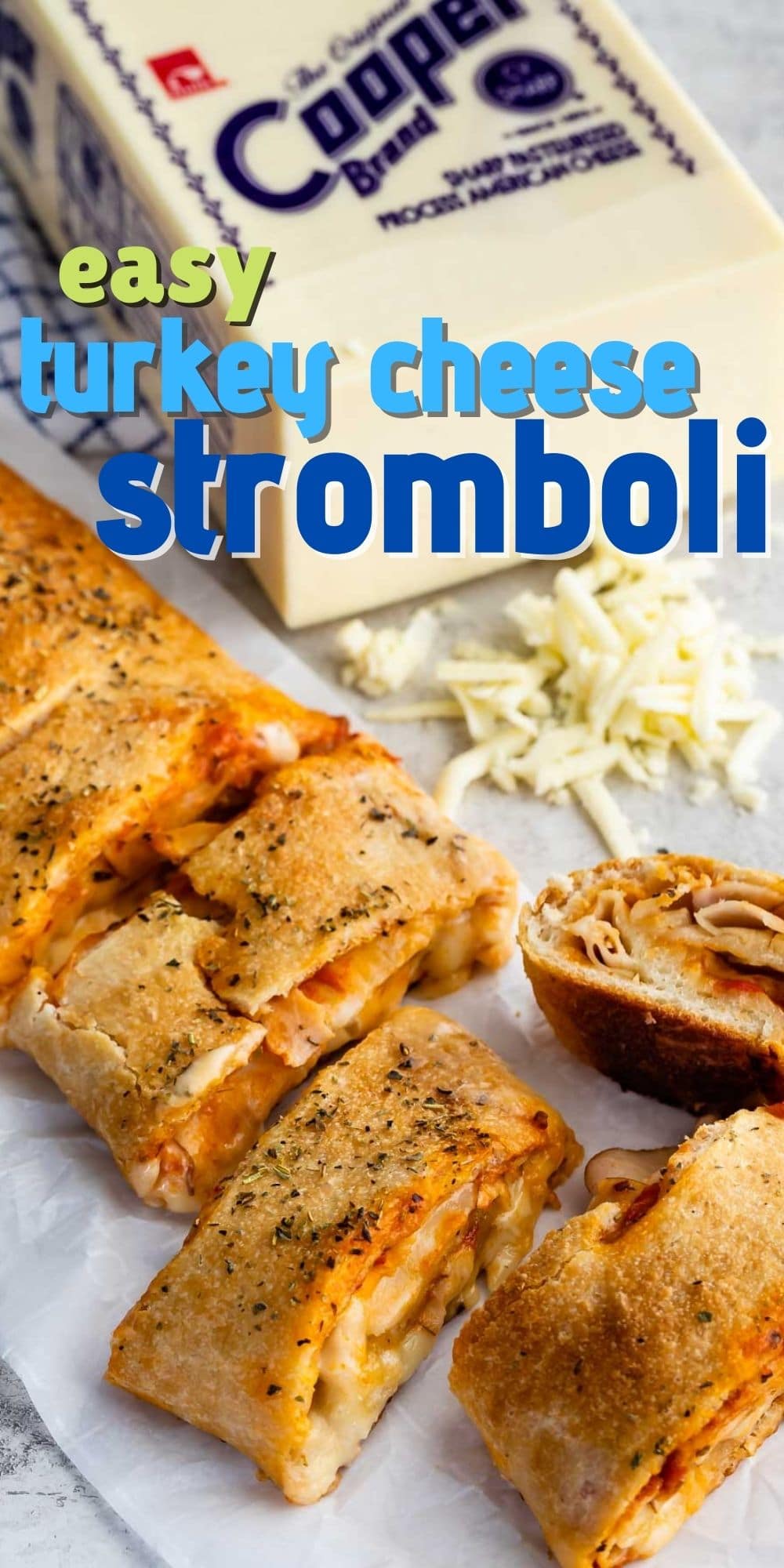 sliced Stromboli with block of Cooper cheese behind