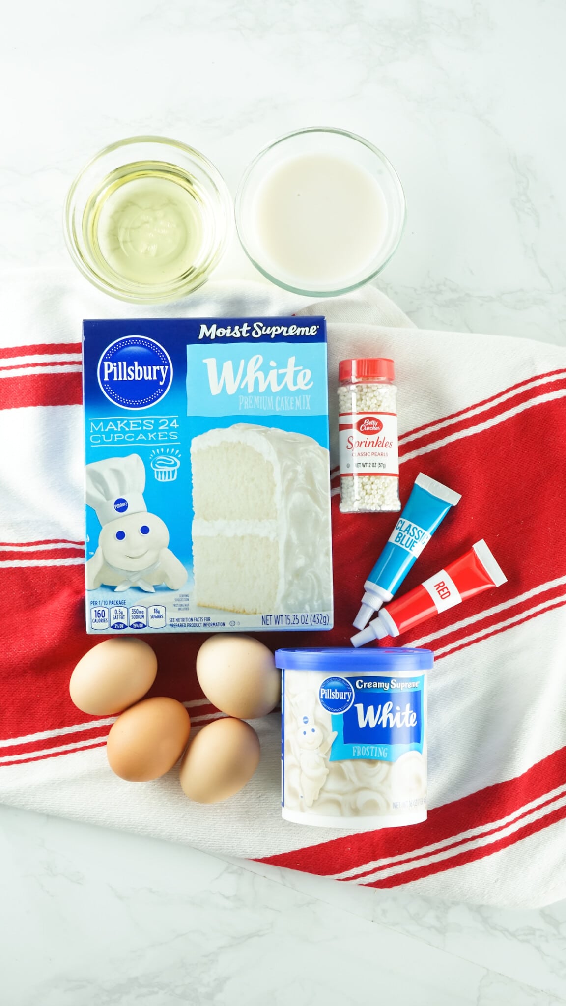 Overhead shot of all the ingredients needed to make the american flag cupcake cake