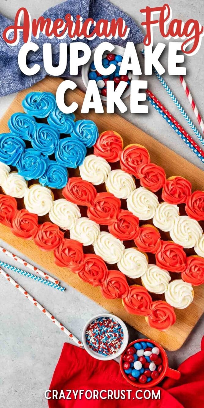 Overhead shot of american flag cupcake cake next to patriotic toppings and straws