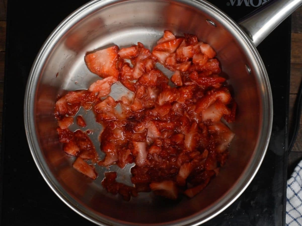 crushed strawberries in saucepan.