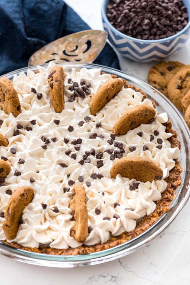 No bake chocolate chip cookie pudding pie topped with chocolate chip cookies