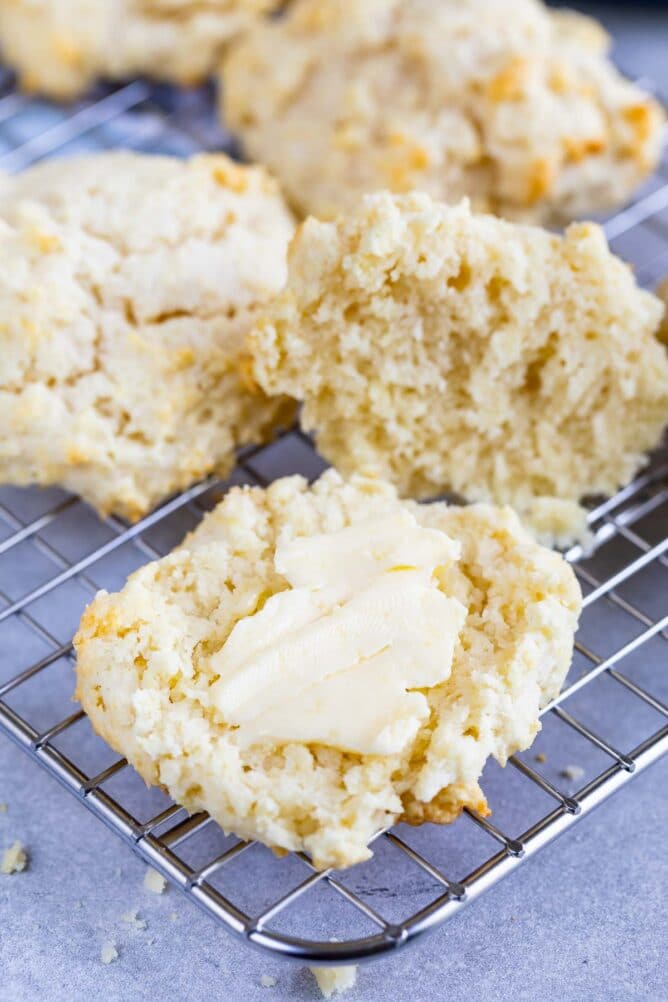 biscuit on rack cut open with butter