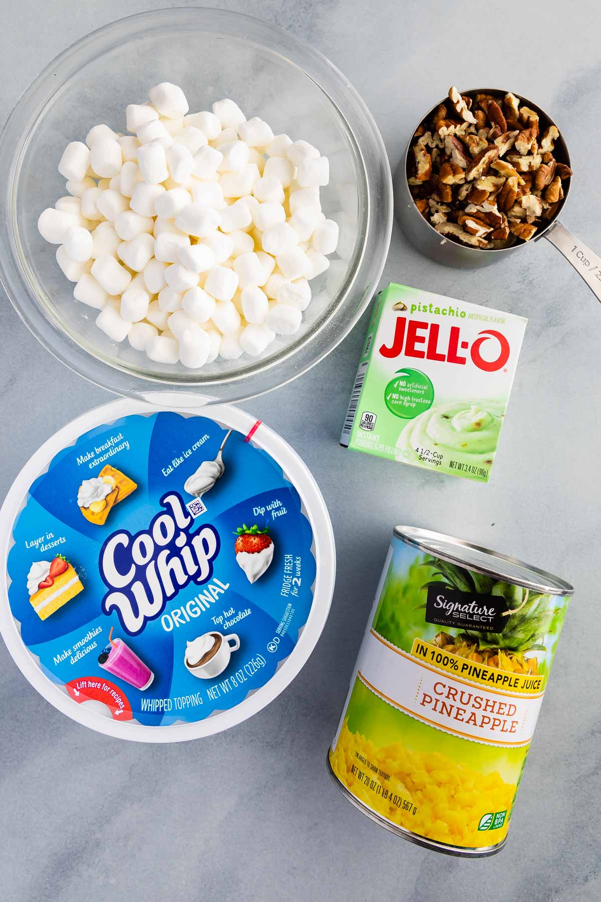 ingredients in Watergate salad photo: marshmallows, nuts, cool whip, pudding box, pineapple can