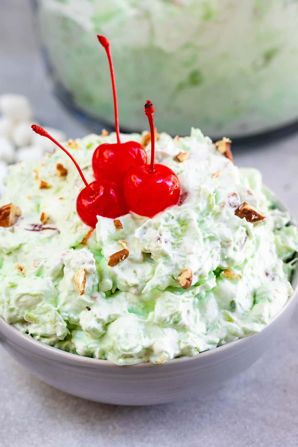 bowl of fluff with cherries on top