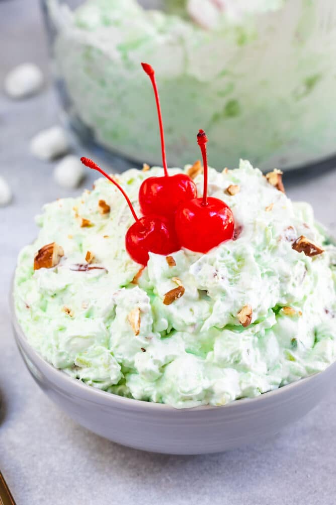 bowl of fluff with cherries on top