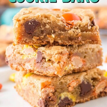 Three loaded cookie bars with recipe title on top of image