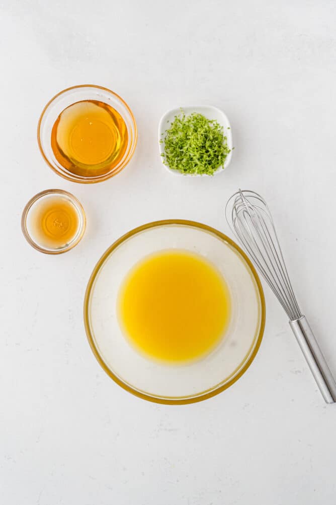 Overhead shot of all measured ingredients needed to make the fruit salad dressing