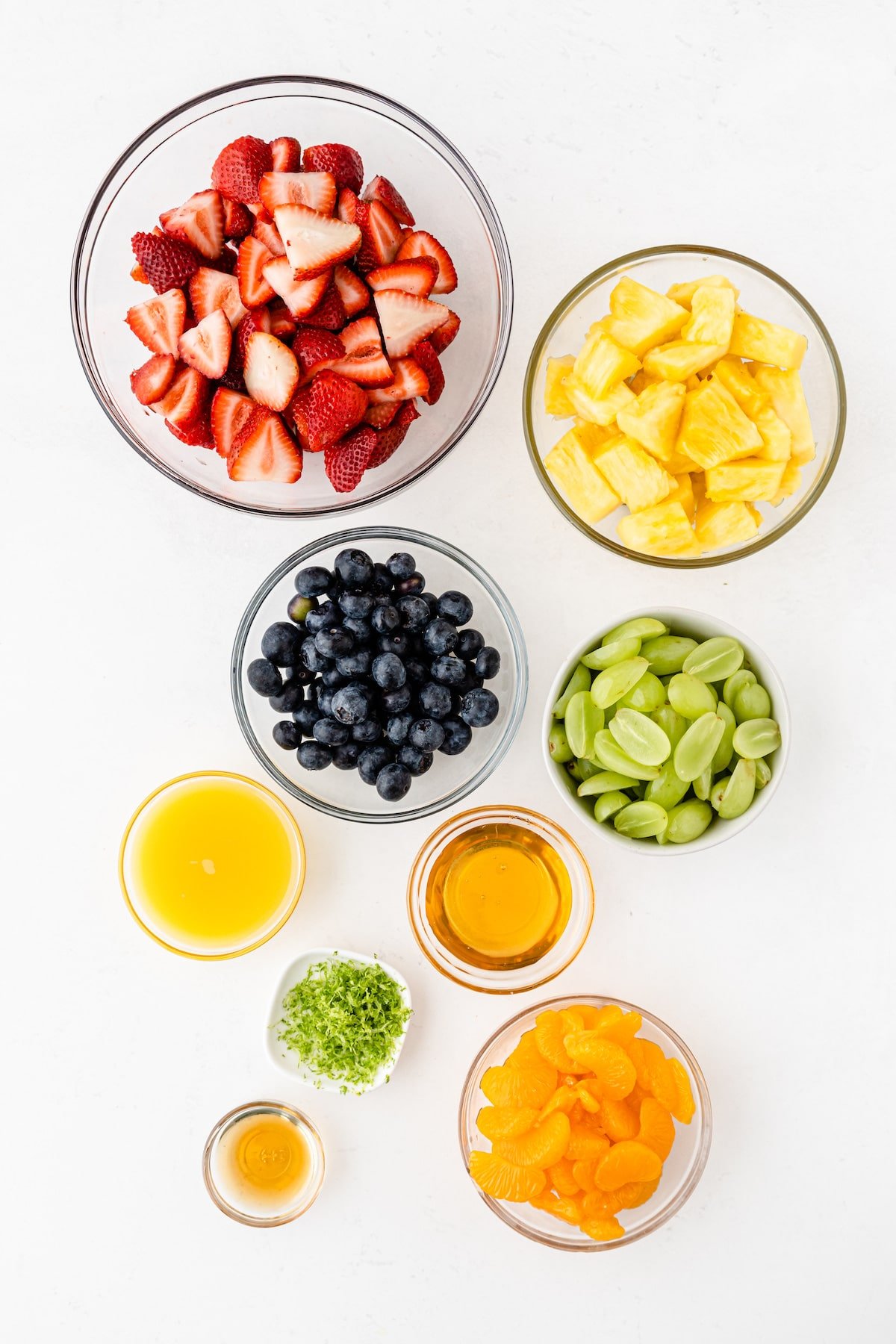 Overhead shot of all ingredients needed to make fruit salad