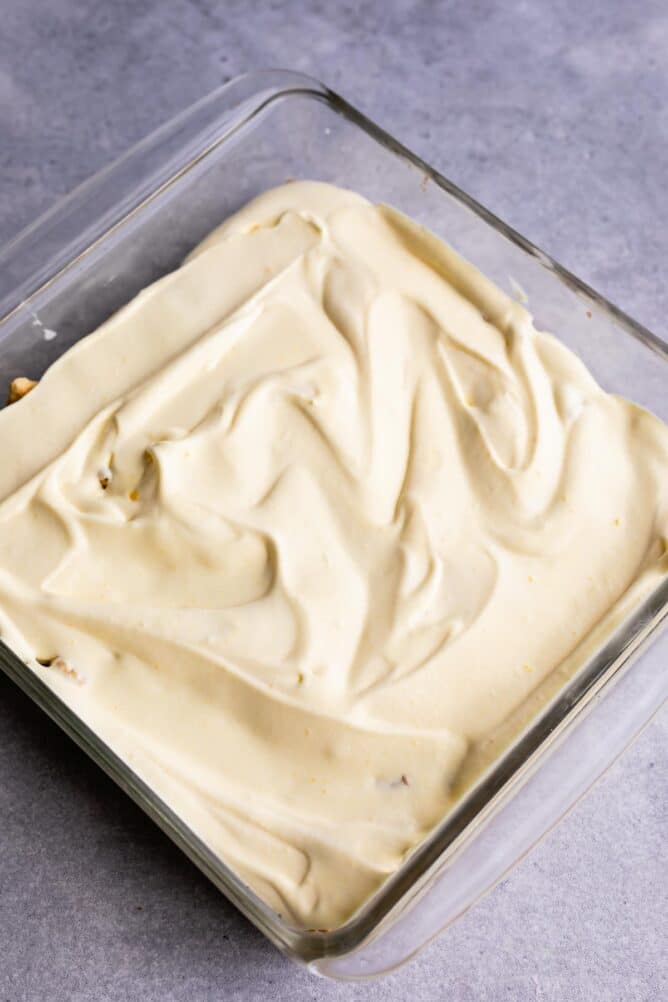 Overhead shot of pudding on top of Golden Oreo crust in square baking dish