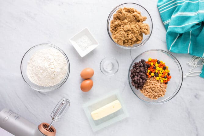 Overhead shot of all ingredients measured out needed to make loaded cookie bars