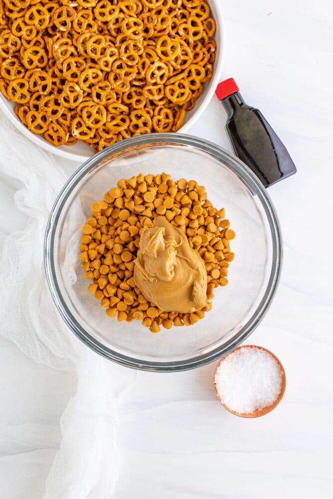 Overhead shot of butterscotch chips with peanut butter and other ingredients around it