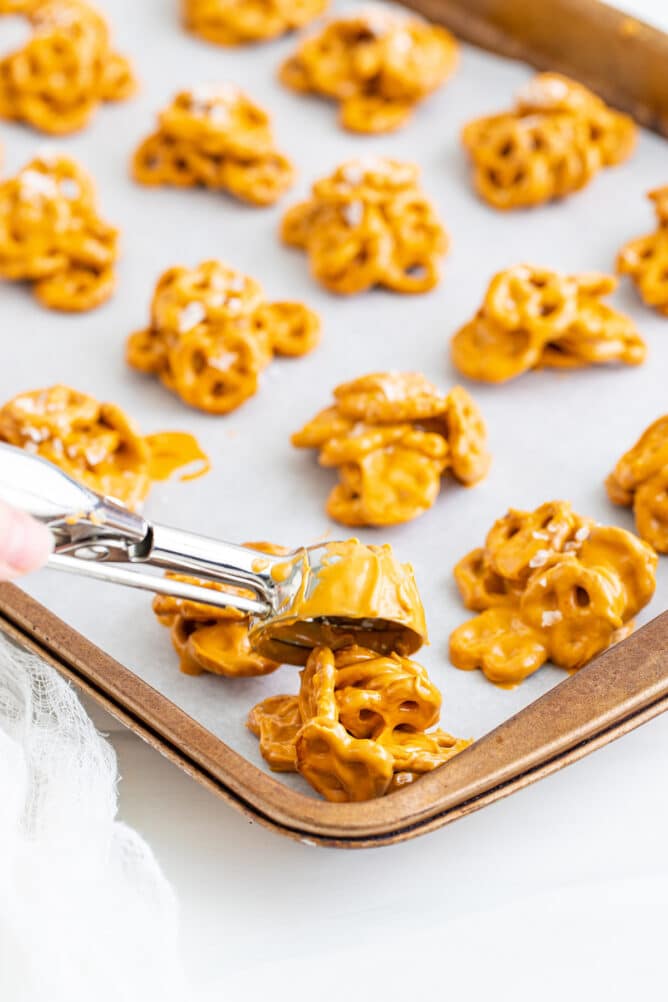 No bake pretzel cookies being dropped onto baking sheet