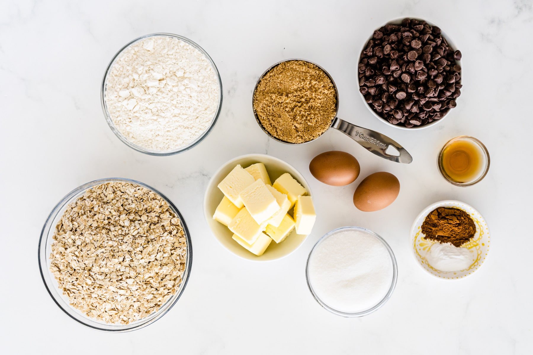 Overhead shot of all measured ingredients needed to make oatmeal chocolate chip cookies