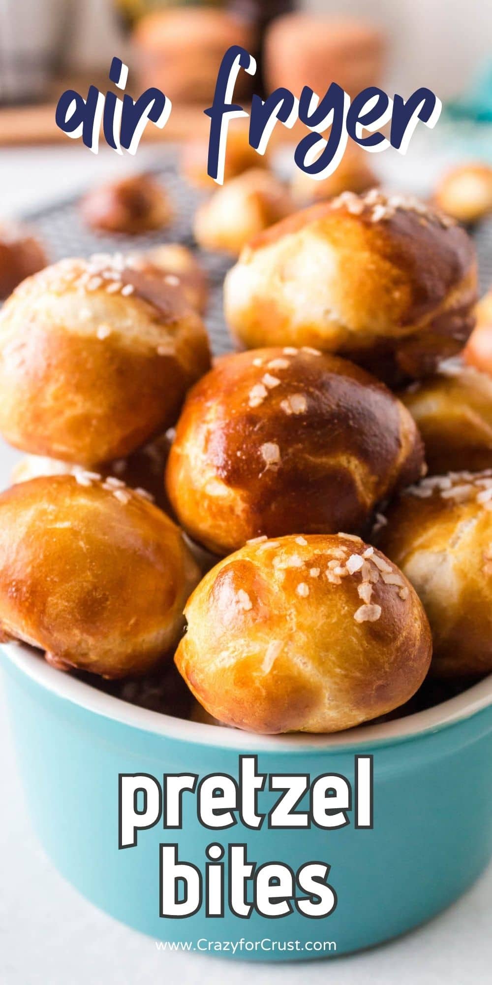 Small turquoise ramekin filled with pretzel bites with recipe title on image