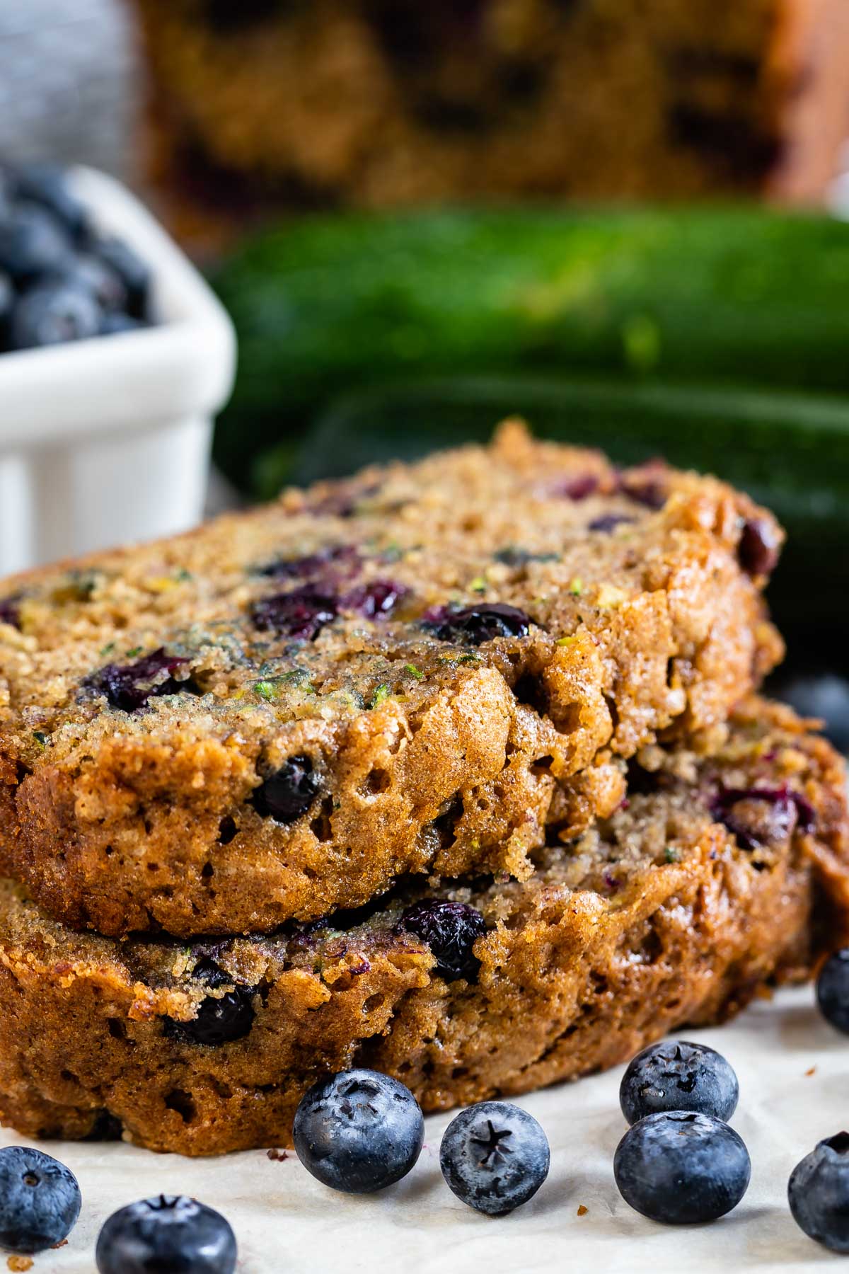 Two slices of Blueberry Zucchini bread stacked on eachother