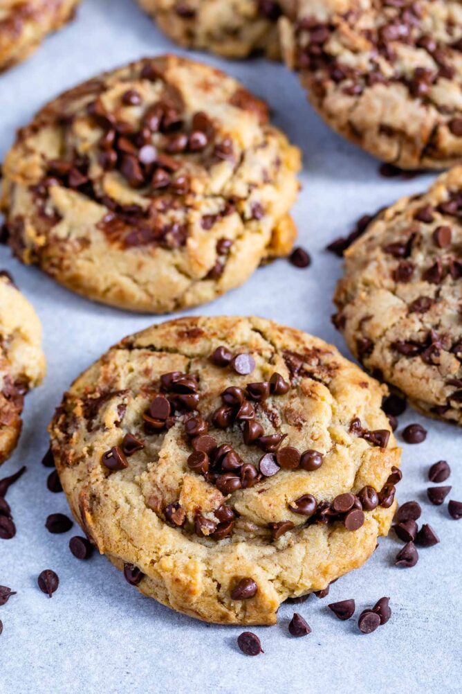 Bakery style chocolate chip cookies on parchment paper