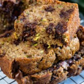 stack of slices of chocolate chip zucchini bread with one slice cut in half