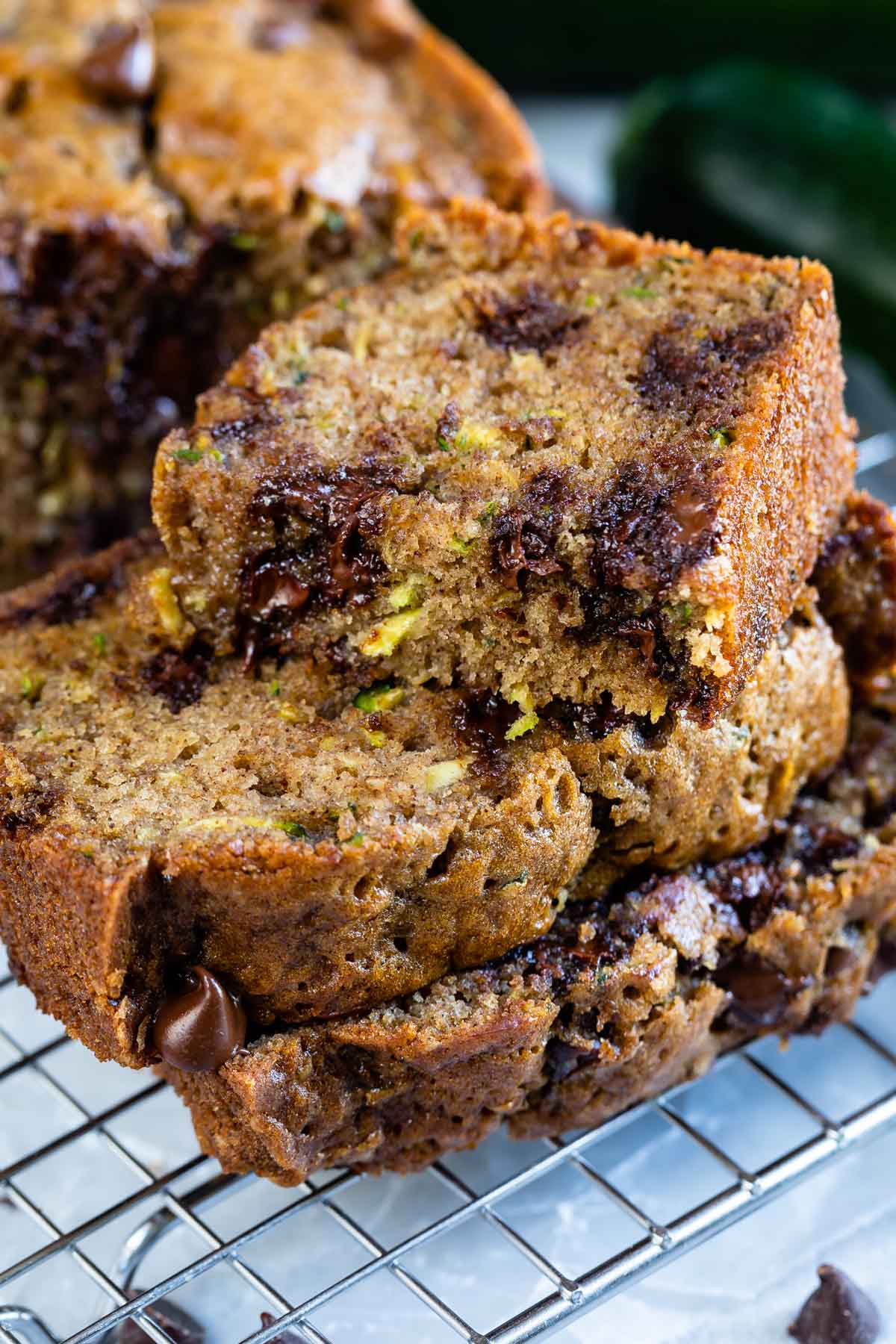 stack of slices of chocolate chip zucchini bread with one slice cut in half