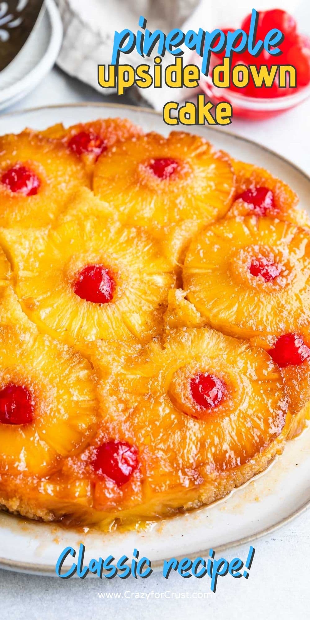 Overhead shot of pineapple upside down cake with recipe title on top of image
