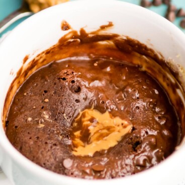 chocolate cookie in a mug with peanut butter
