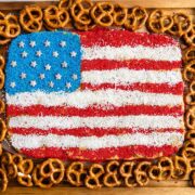 Overhead view of peanut butter flag dip with pretzels around it