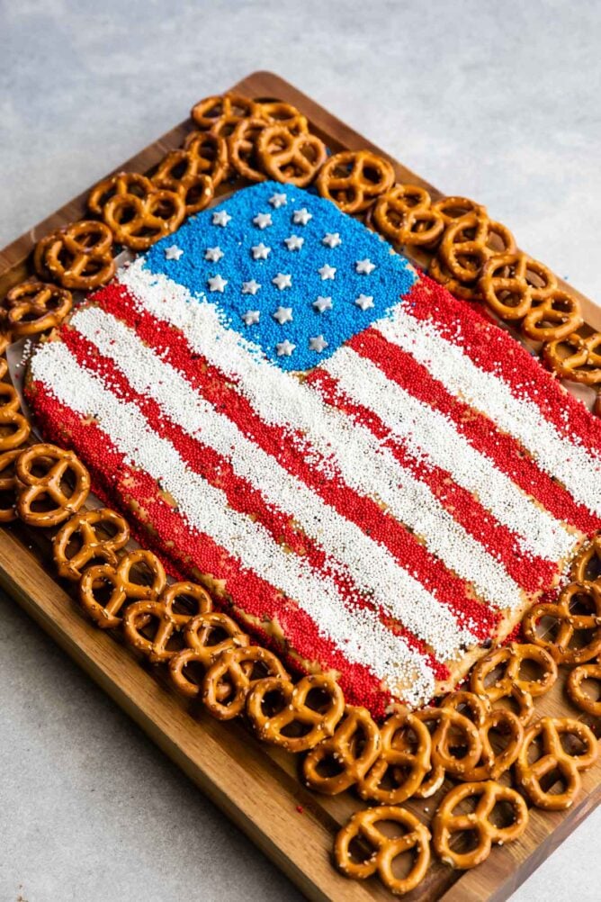 Overhead view of peanut butter flag dip with pretzels around it