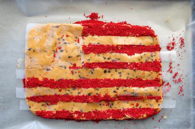 Overhead shot of peanut butter flag dip with red sprinkle stripes completed