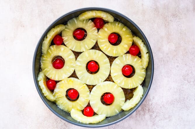 cake pan with pineapple rings and pineapple