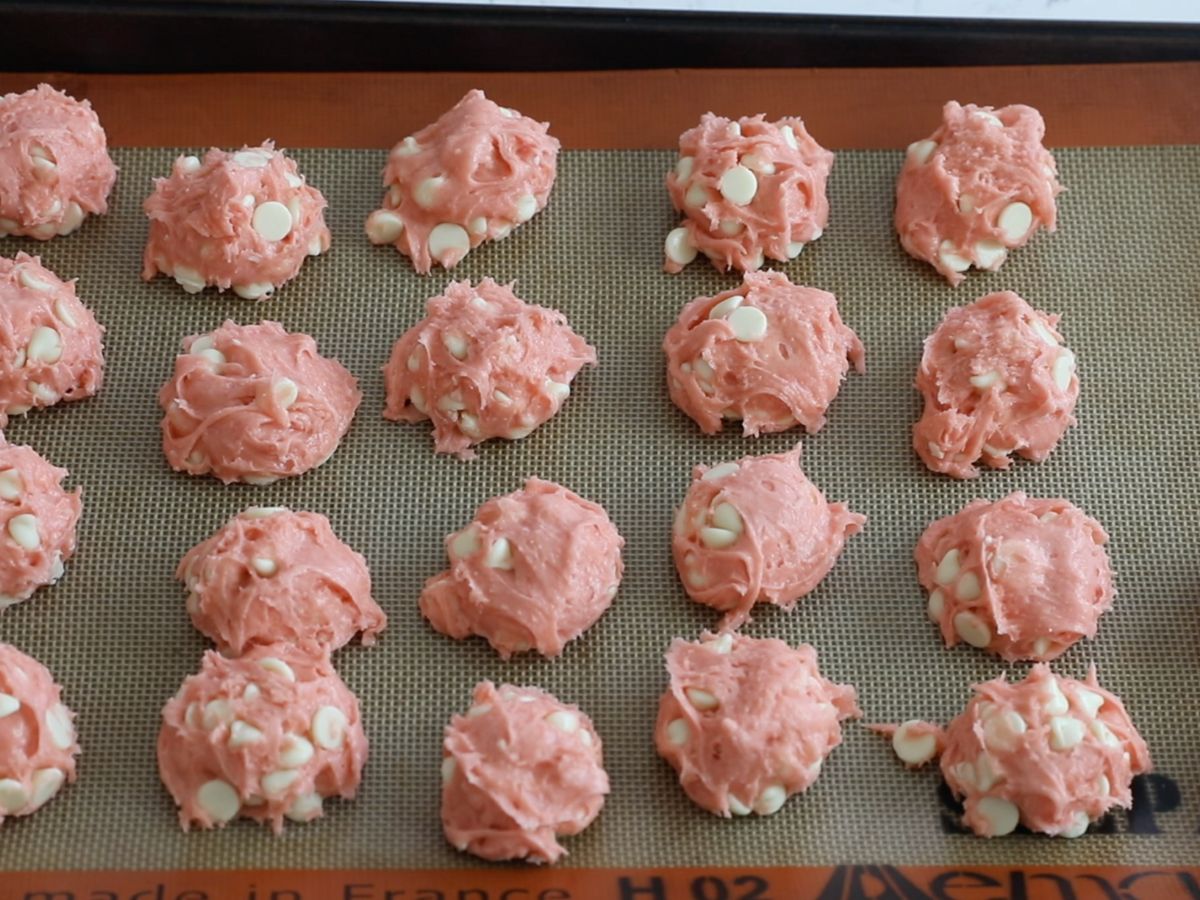 cookie sheet with silpat and cookie dough.