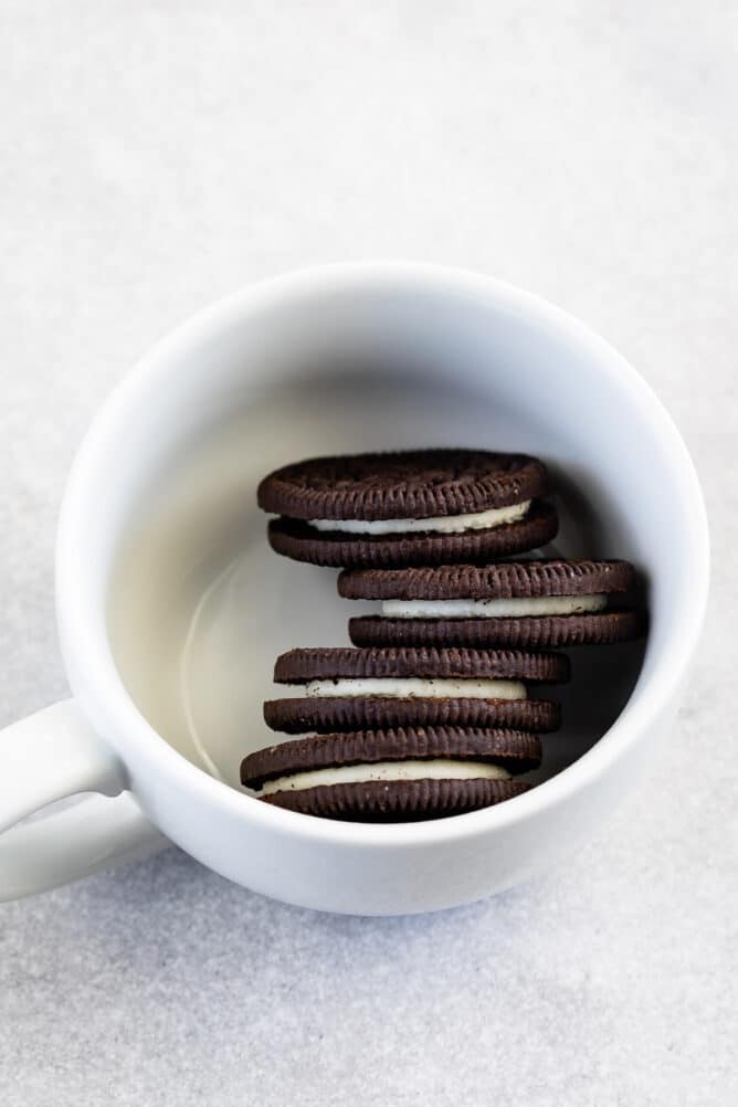 Overhead shot of 4 Oreo cookies in a mug