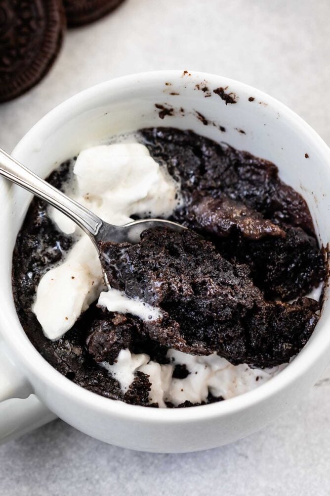 Overhead shot of Oreo mug cake with ice cream on top