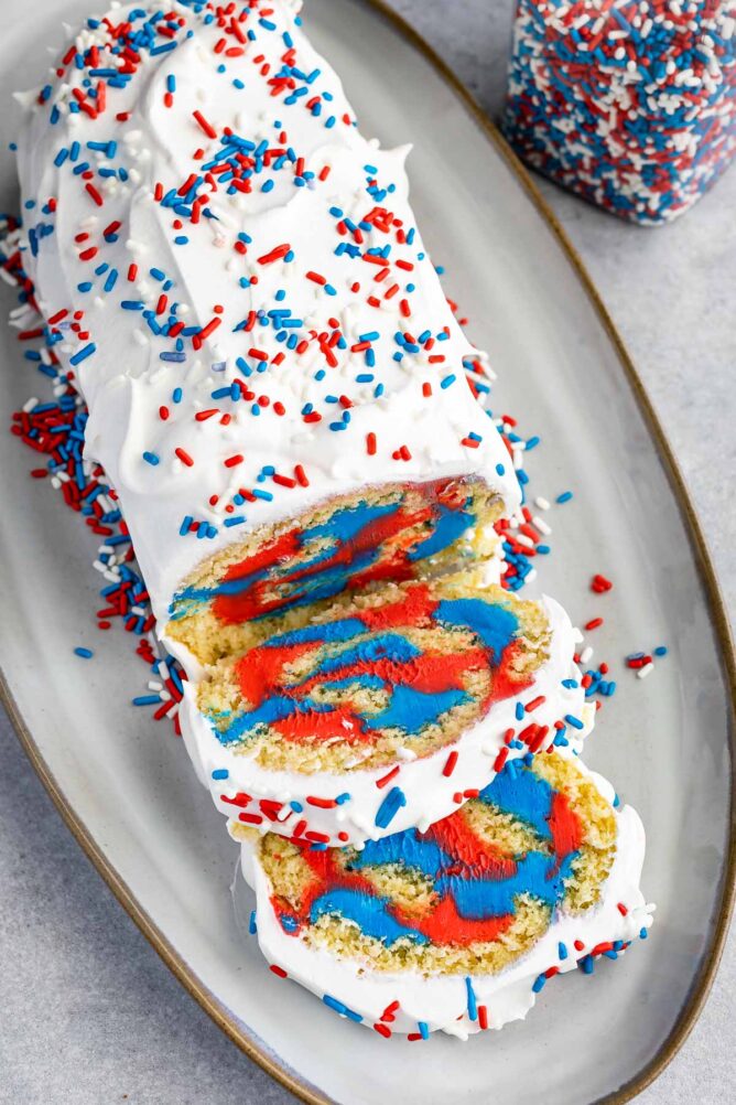 Overhead photo of patriotic cake roll with covered with red, white and blue spinkles