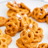 Close up of no bake pretzel cookies on a plate with recipe title on top of image