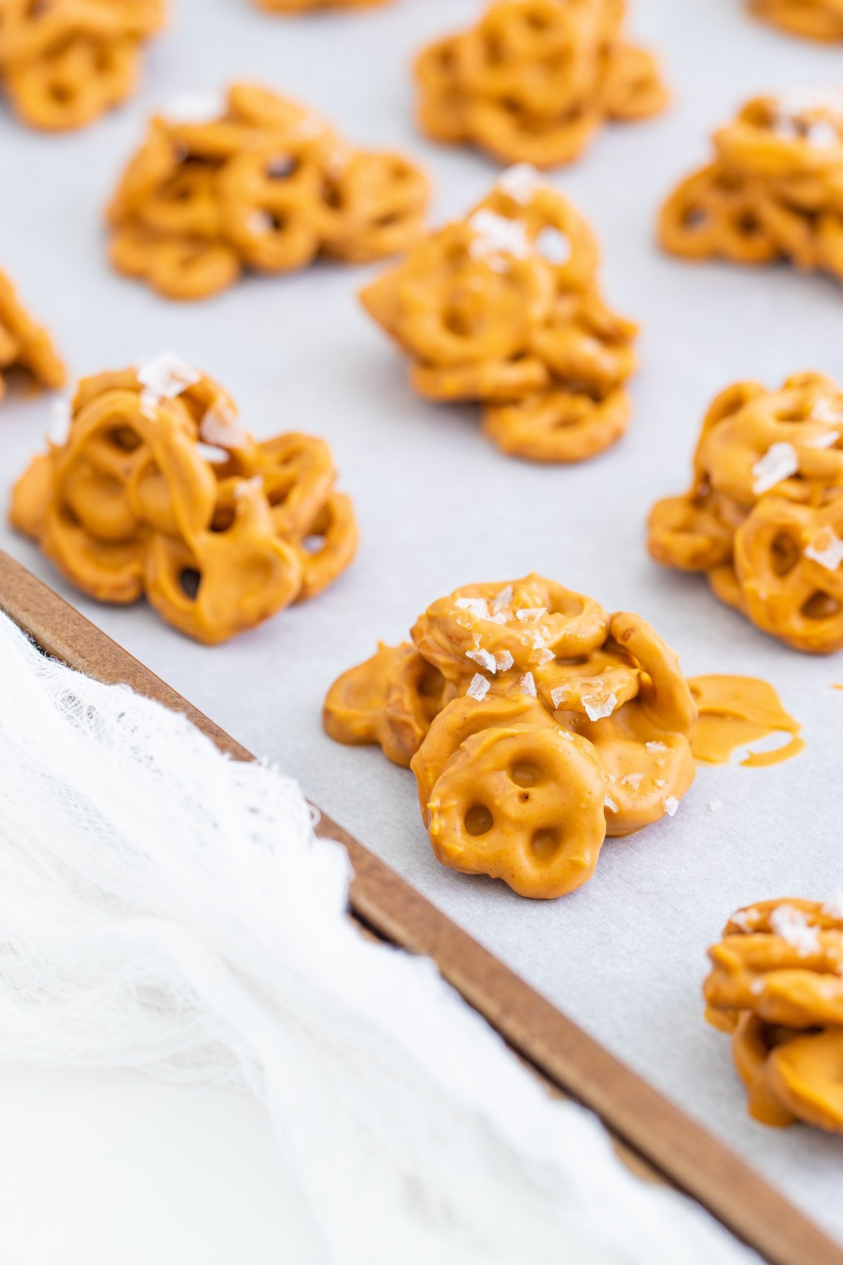 Close up shot of no bake pretzel cookies on a baking sheet