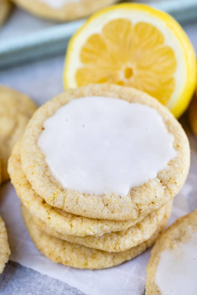 Stack of lemon cookies with icing on the top cookie