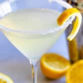 lemon drink in martini glass with shaker behind