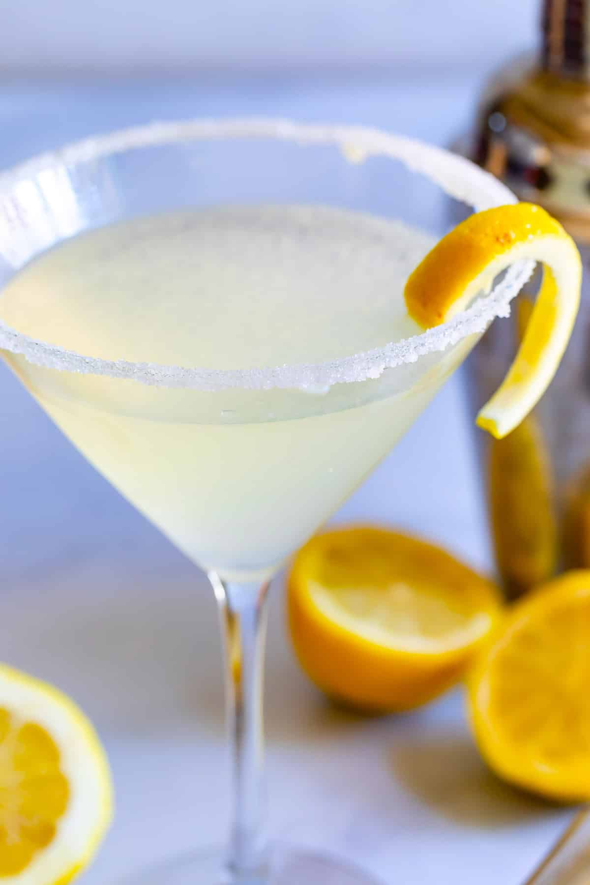 lemon drink in martini glass with shaker behind