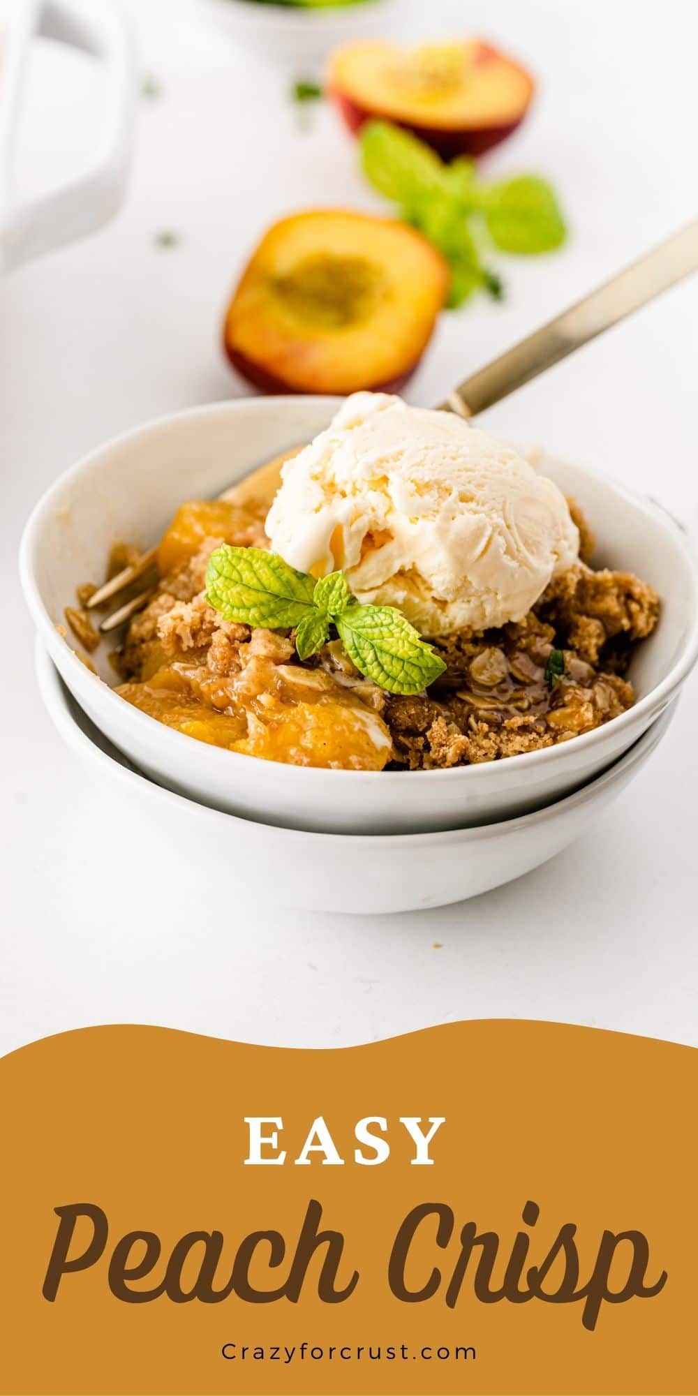 Bowl of peach crisp topped with vanilla ice cream and recipe title on bottom of photo