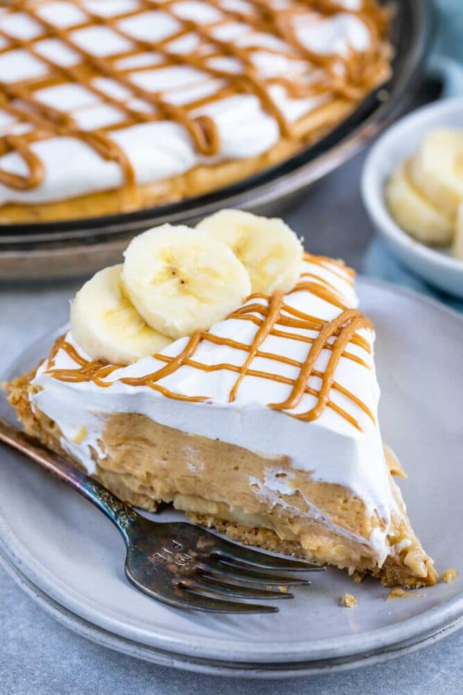 One slice of no bake peanut butter banana cream pie on plate